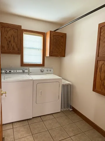 a utility room with a sink a washer and dryer