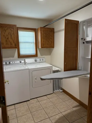 a utility room with a sink a washer and dryer