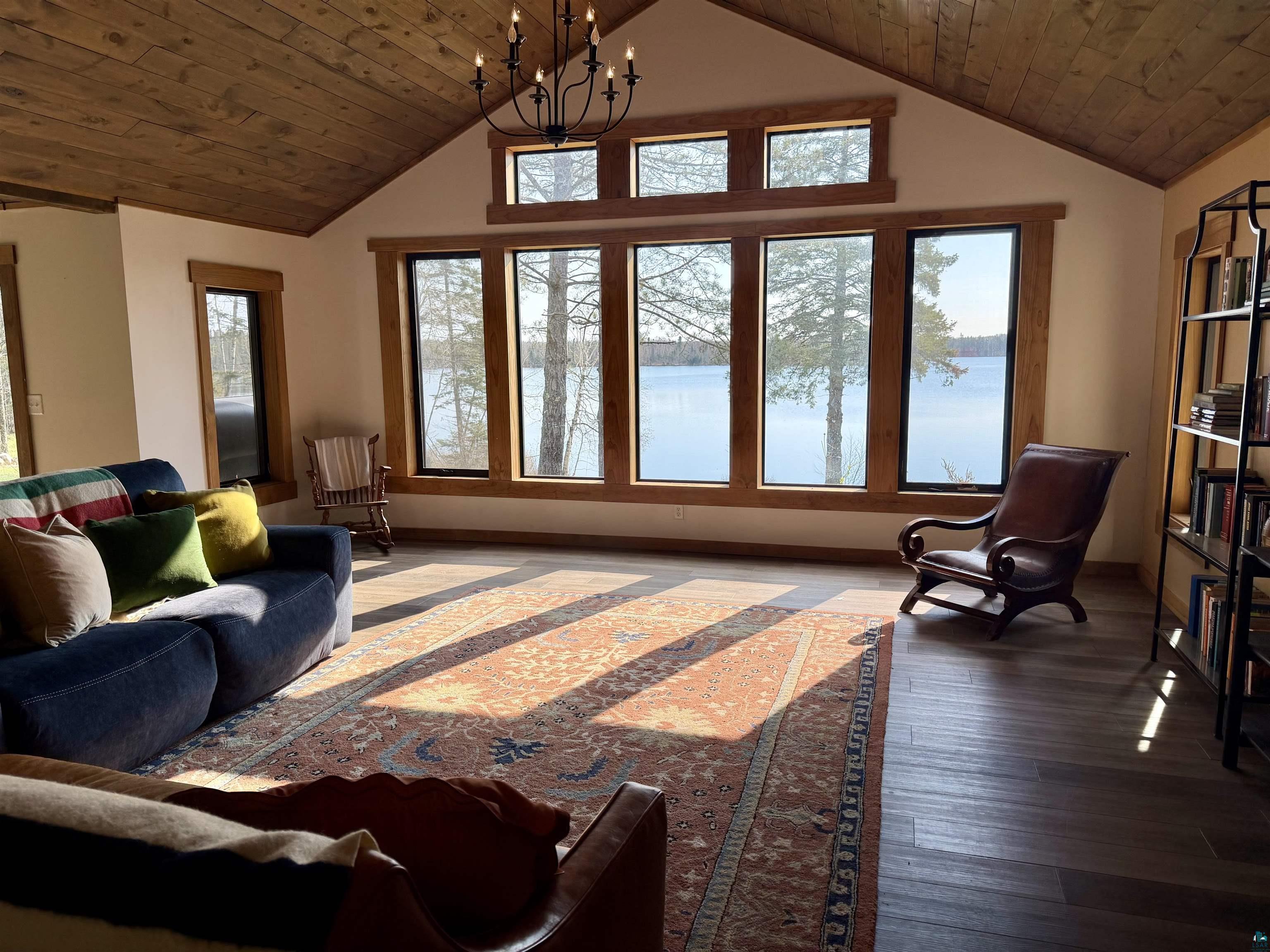 5274 Marble Lake Road Two Harbors, MN 55616 - Photo 4 of 79 Vaulted wood-plank ceiling with a black chandelier