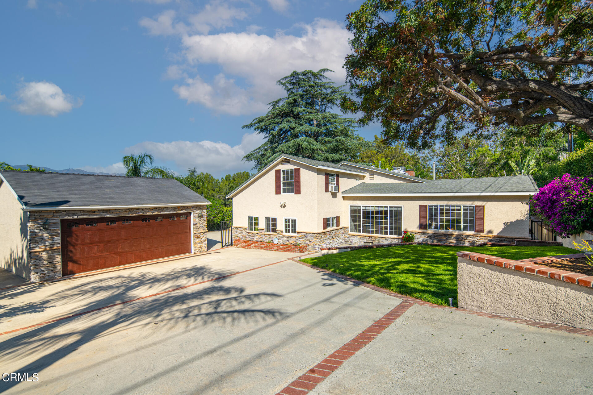 5223 Ramsdell Avenue La Crescenta, CA 91214 - Photo 1 of 1 a front view of a house with a yard and garage