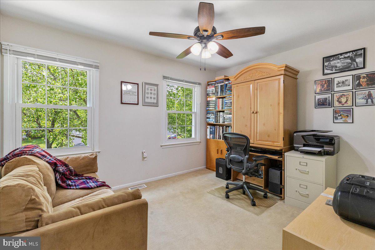 3 Strathmore Place Princeton Junction, NJ 08550 - Photo 21 of 29 a living room with furniture a window and a flat screen tv