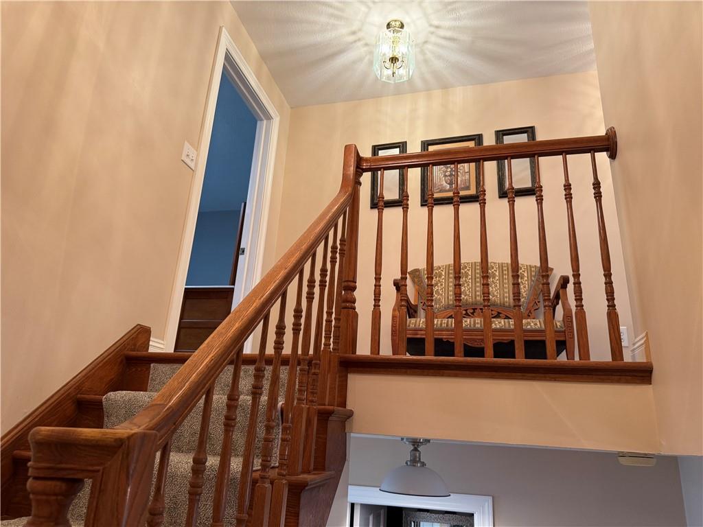 293 Sandy Hill Road Valencia, PA 16059 - Photo 33 of 50 a view of staircase with railing and a chandelier