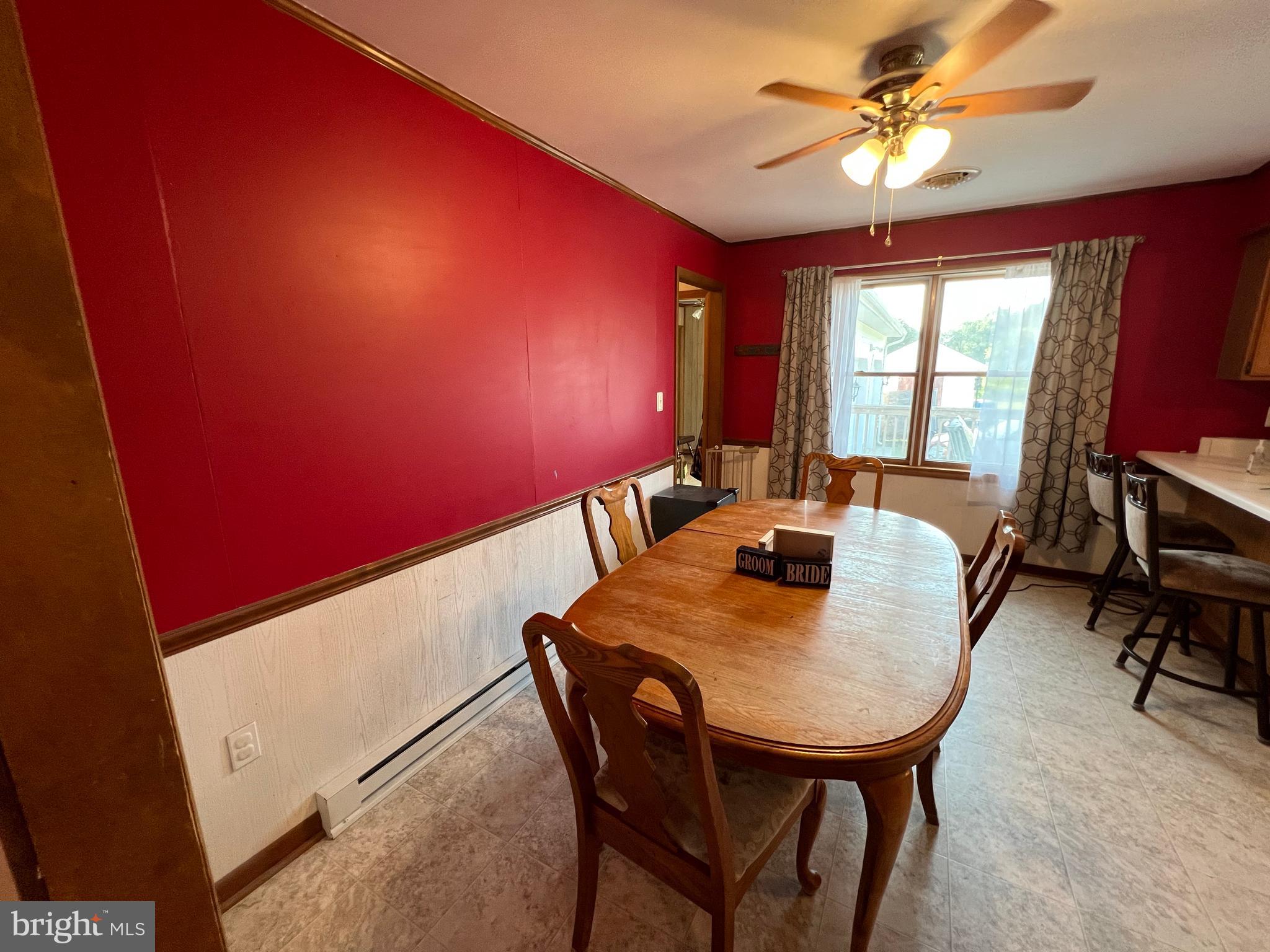34788 Susan Beach Road Laurel, DE 19956 - Photo 20 of 36 a view of a dining room with furniture and a chandelier