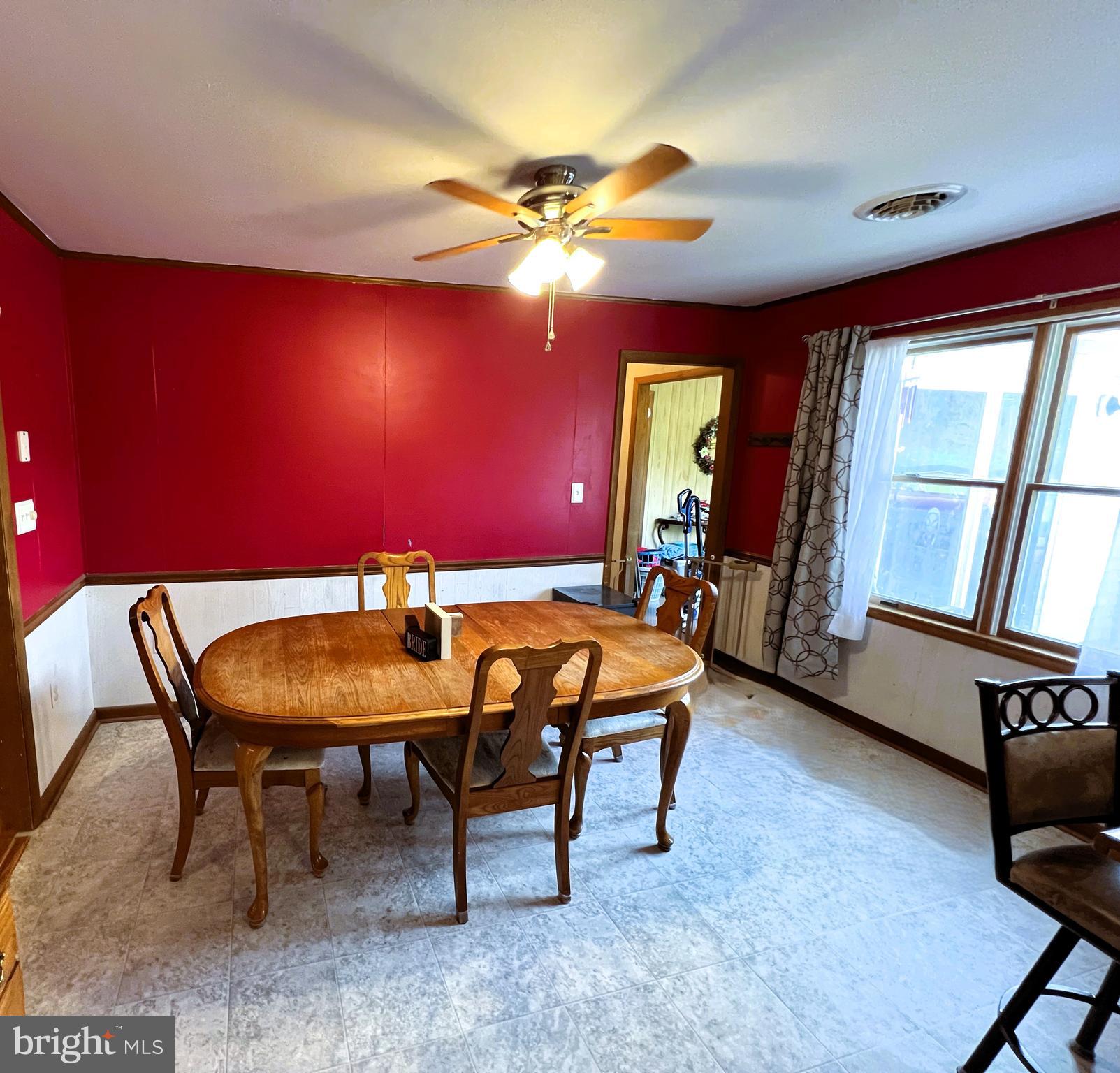 34788 Susan Beach Road Laurel, DE 19956 - Photo 21 of 36 a view of a dining room with furniture and window