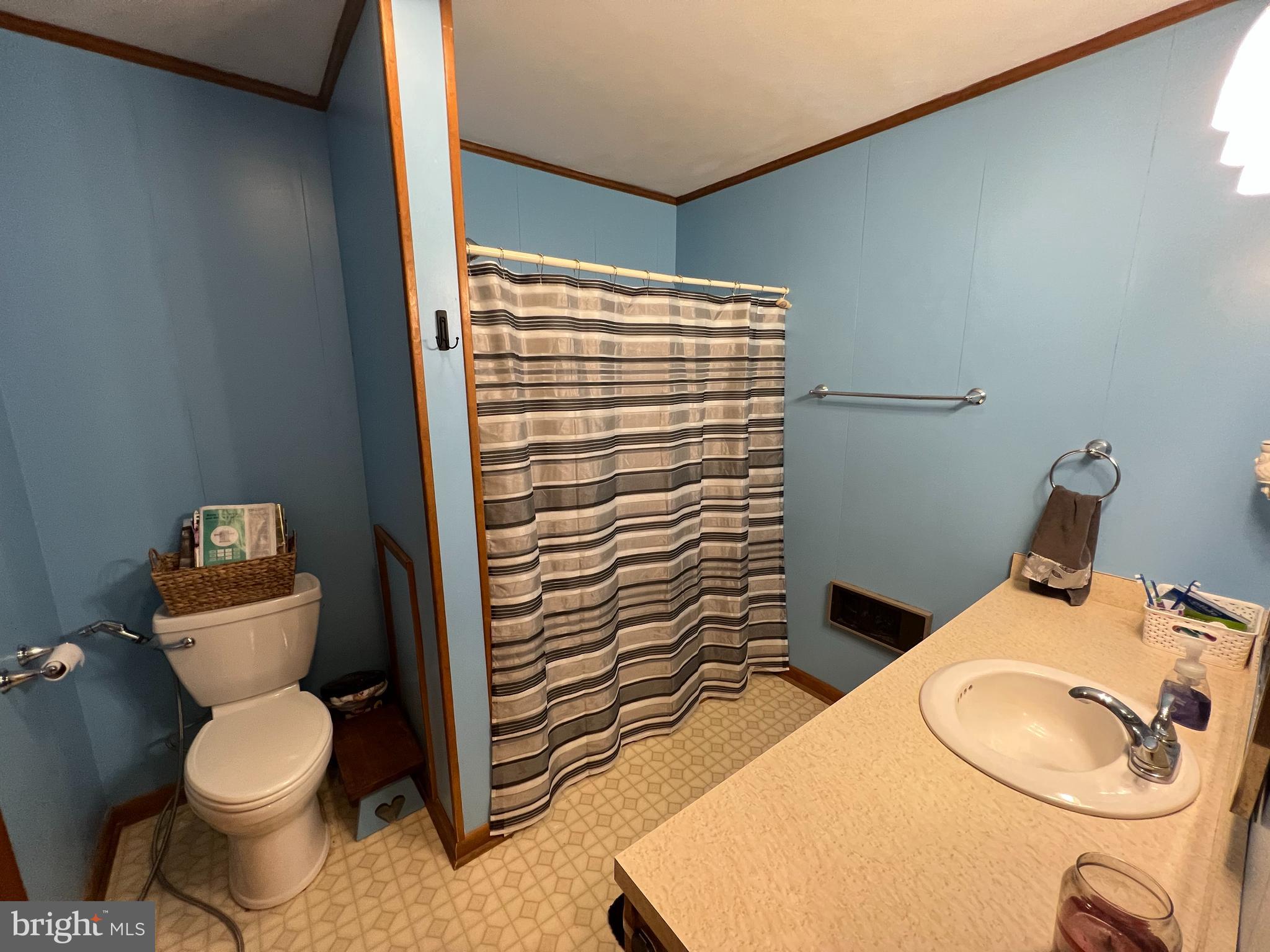 34788 Susan Beach Road Laurel, DE 19956 - Photo 22 of 36 a bathroom with a toilet and a sink