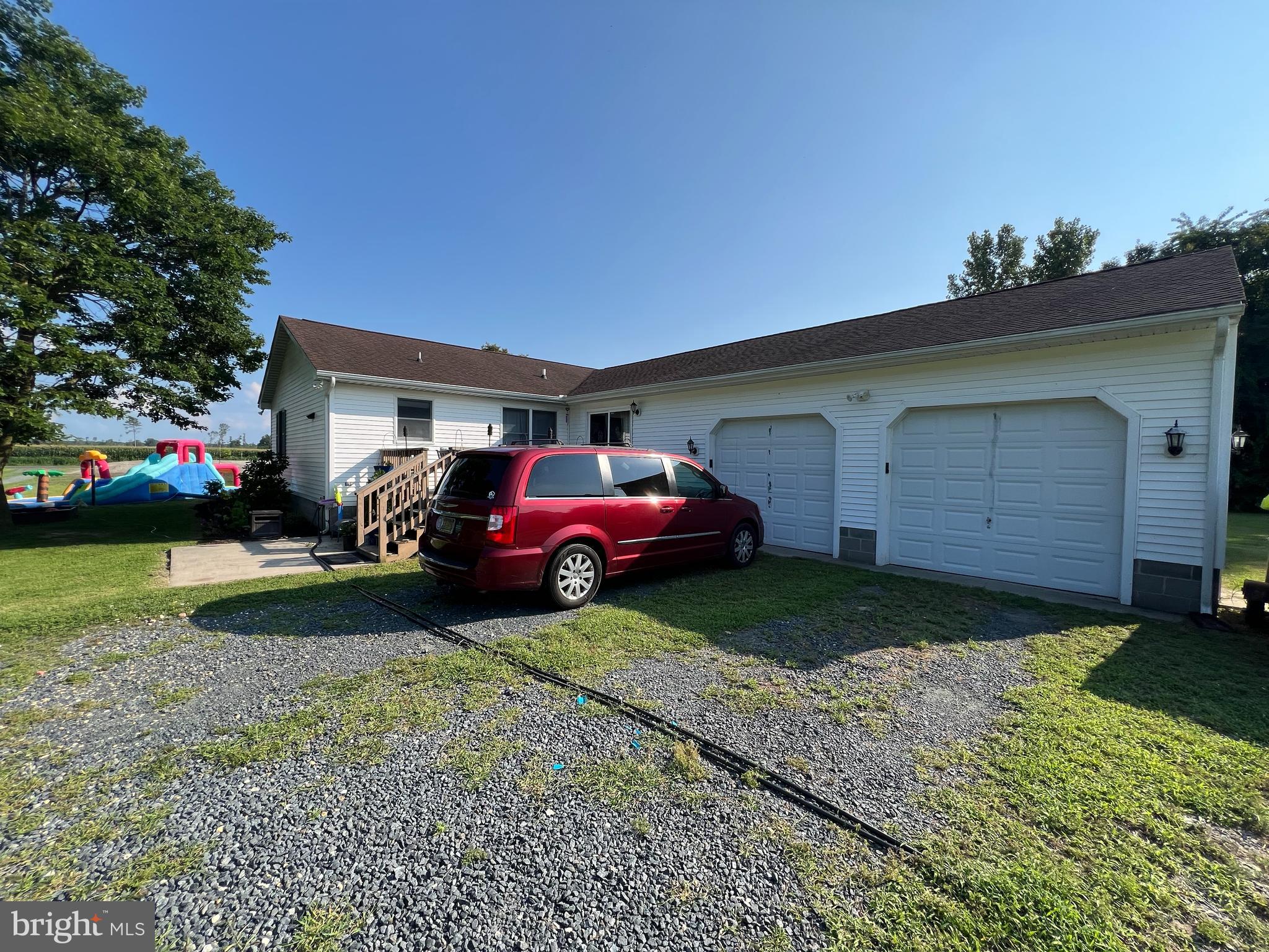 34788 Susan Beach Road Laurel, DE 19956 - Photo 6 of 36 a front view of a house with a garden