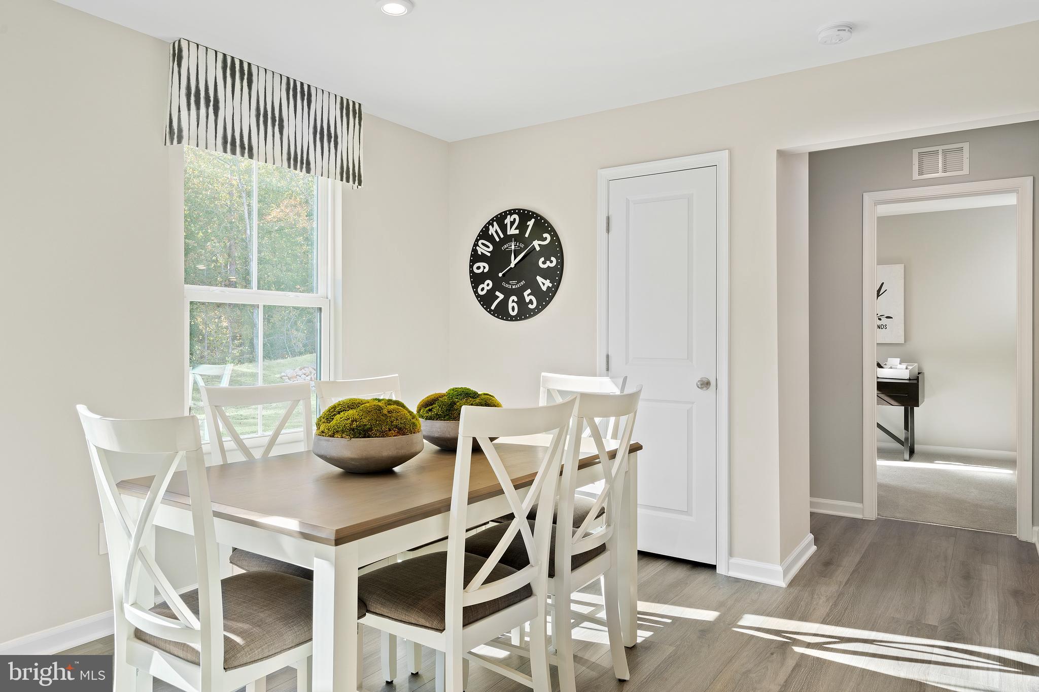 186 Inola Court Inwood, WV 25428 - Photo 10 of 20 a view of a dining room with furniture and wooden floor