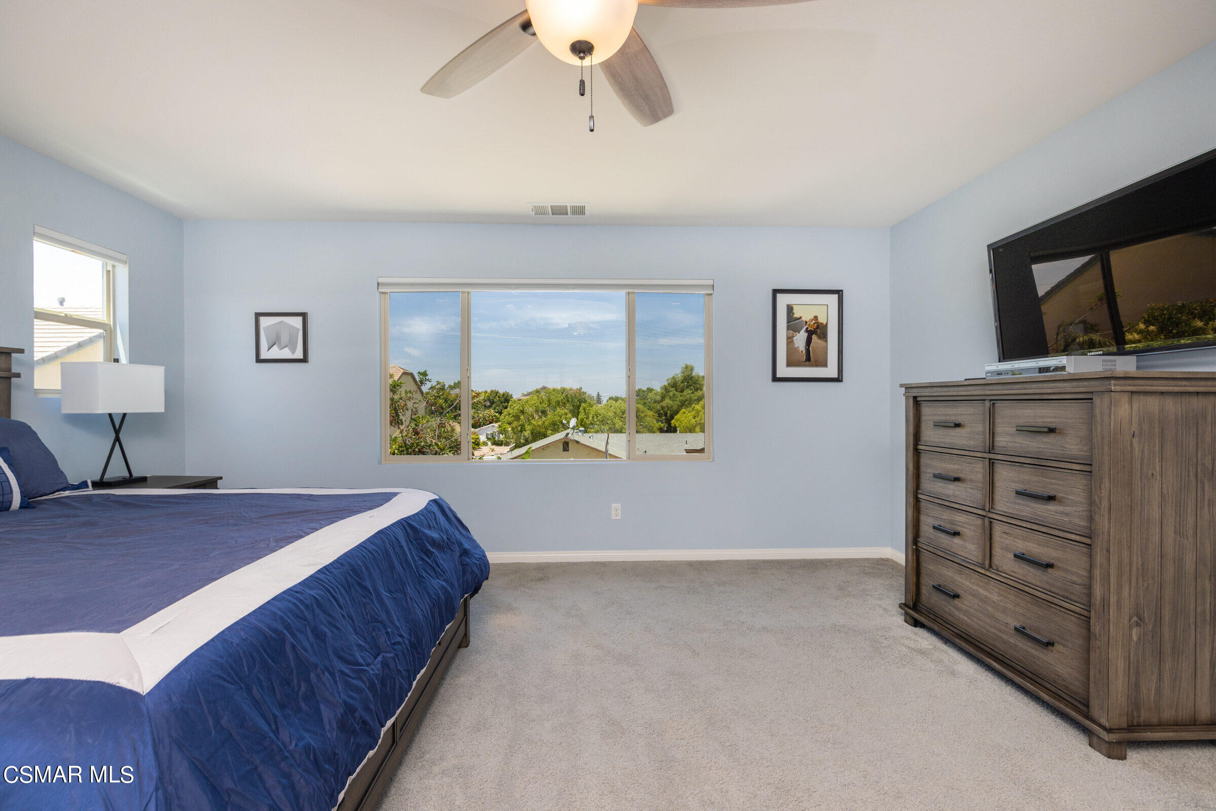 4893 Edenbridge Road Moorpark, CA 93021 - Photo 14 of 31 a bedroom with a bed and a chandelier