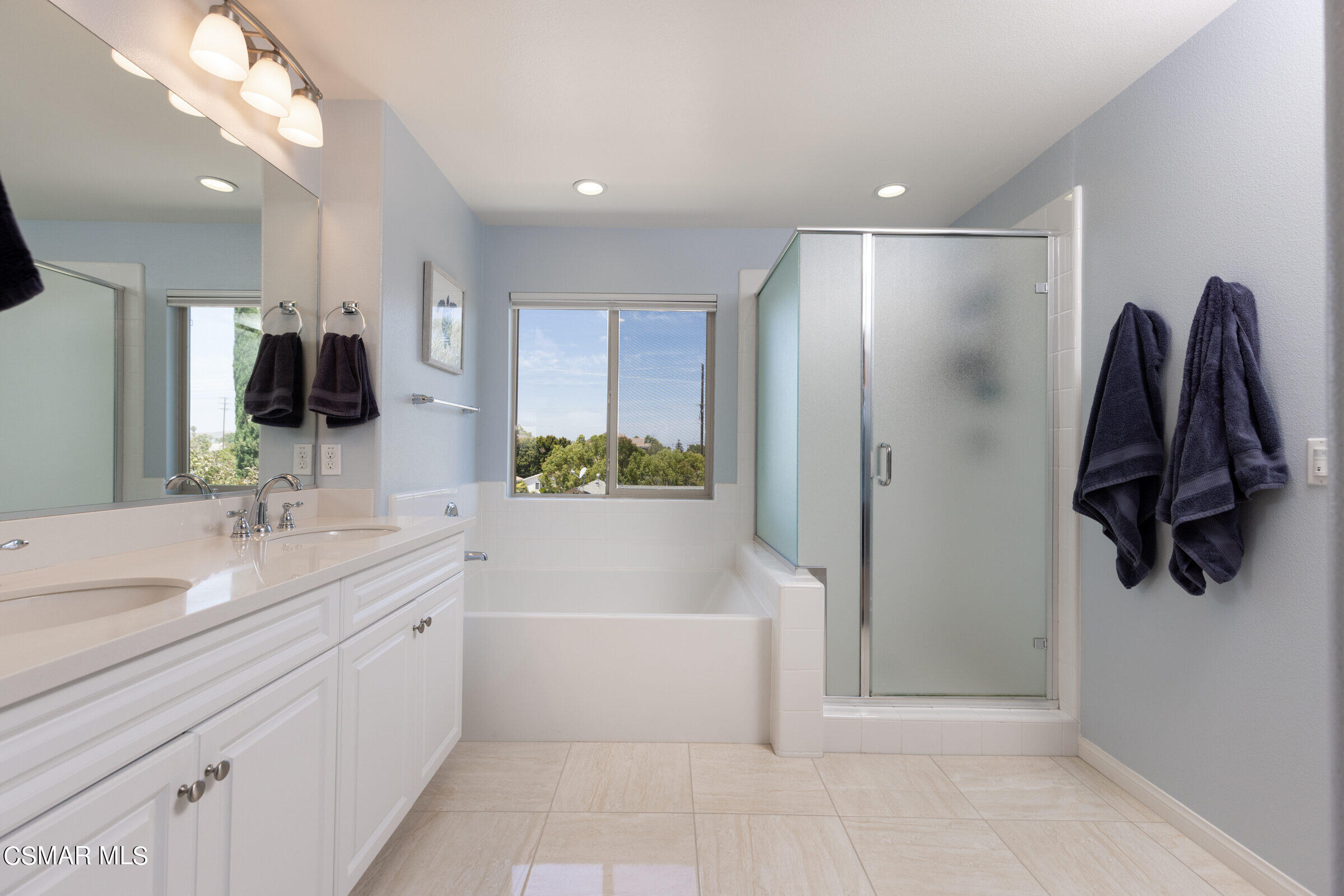 4893 Edenbridge Road Moorpark, CA 93021 - Photo 15 of 31 a bathroom with a tub sink and mirror