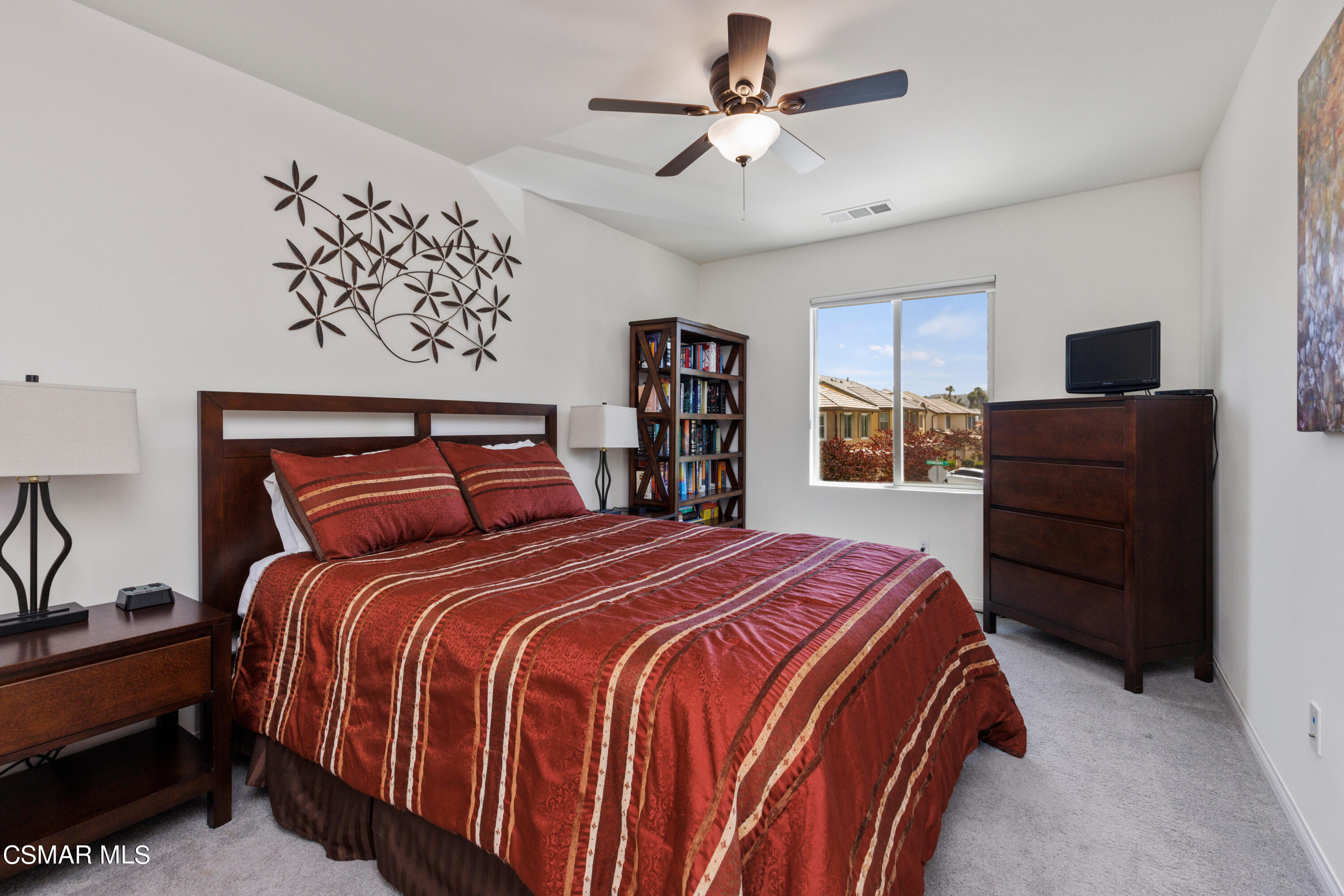 4893 Edenbridge Road Moorpark, CA 93021 - Photo 16 of 31 a bedroom with a bed and a chandelier
