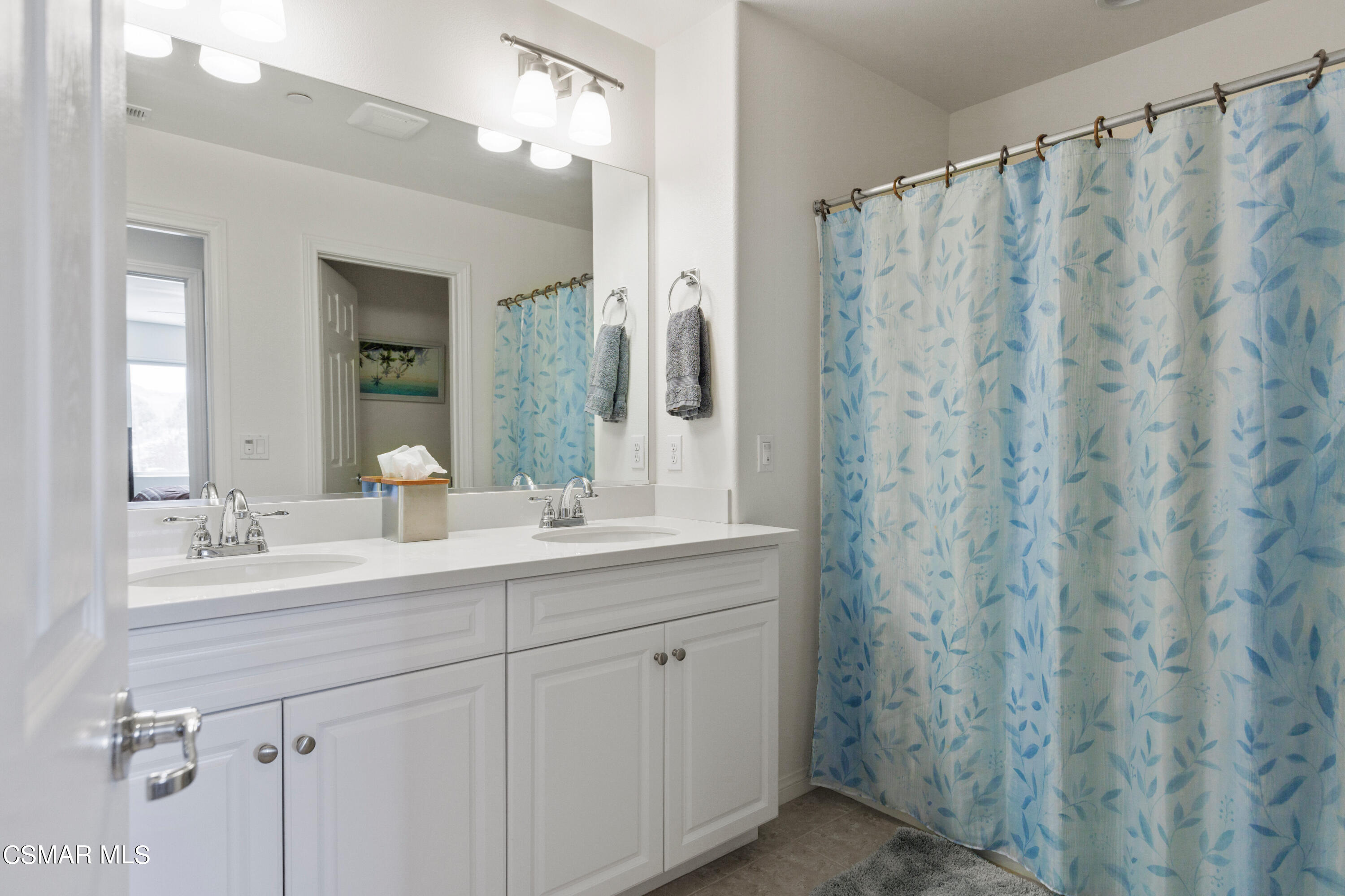 4893 Edenbridge Road Moorpark, CA 93021 - Photo 18 of 31 a bathroom with a double vanity sink mirror and shower