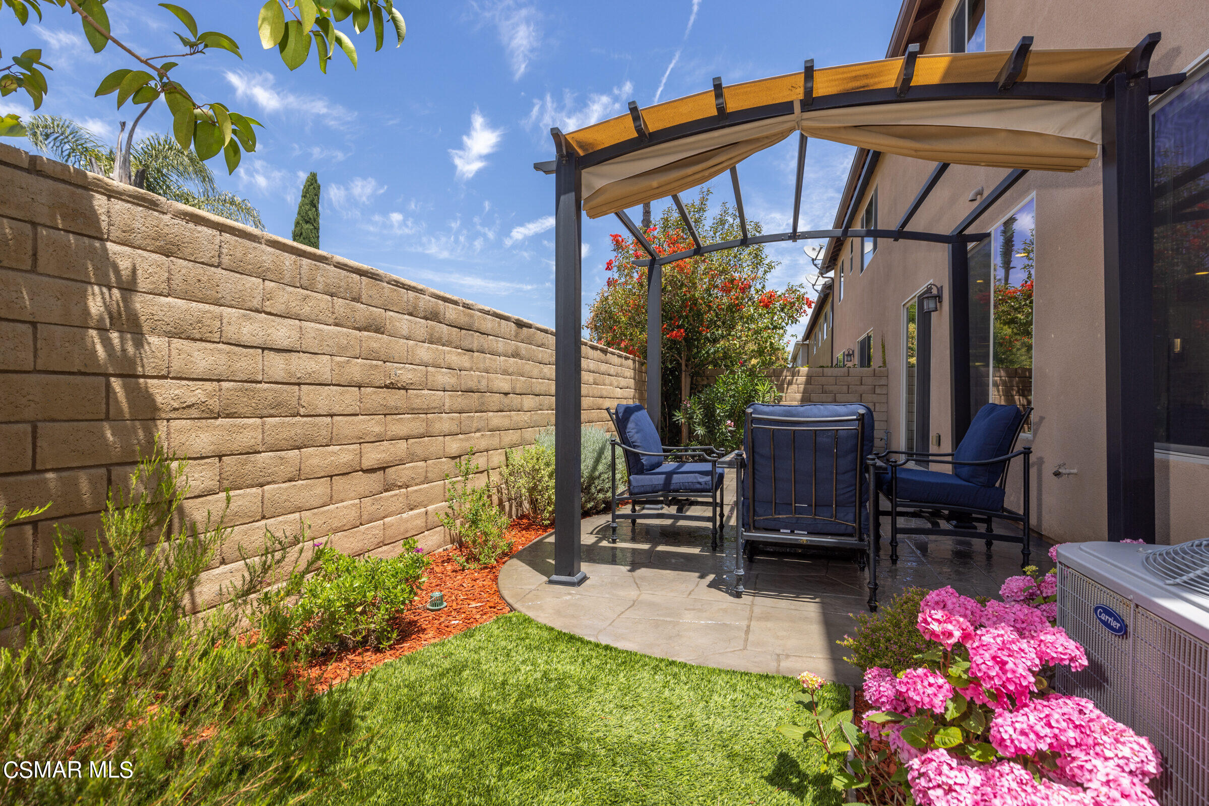 4893 Edenbridge Road Moorpark, CA 93021 - Photo 24 of 31 a backyard of a house with table and chairs