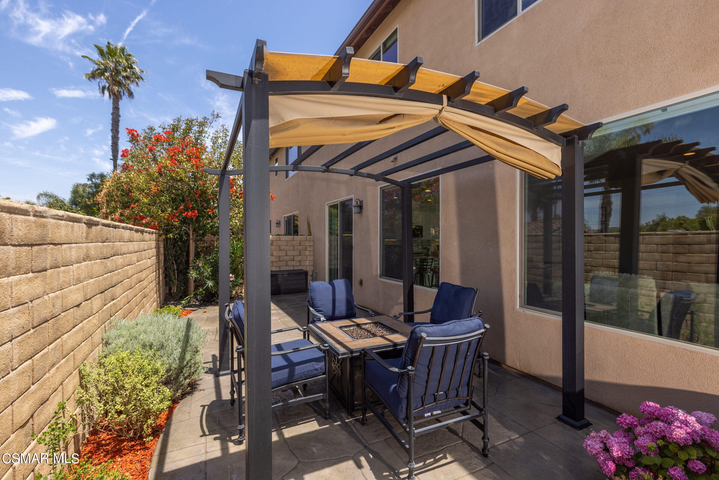 4893 Edenbridge Road Moorpark, CA 93021 - Photo 25 of 31 a view of a patio with table and chairs and potted plants