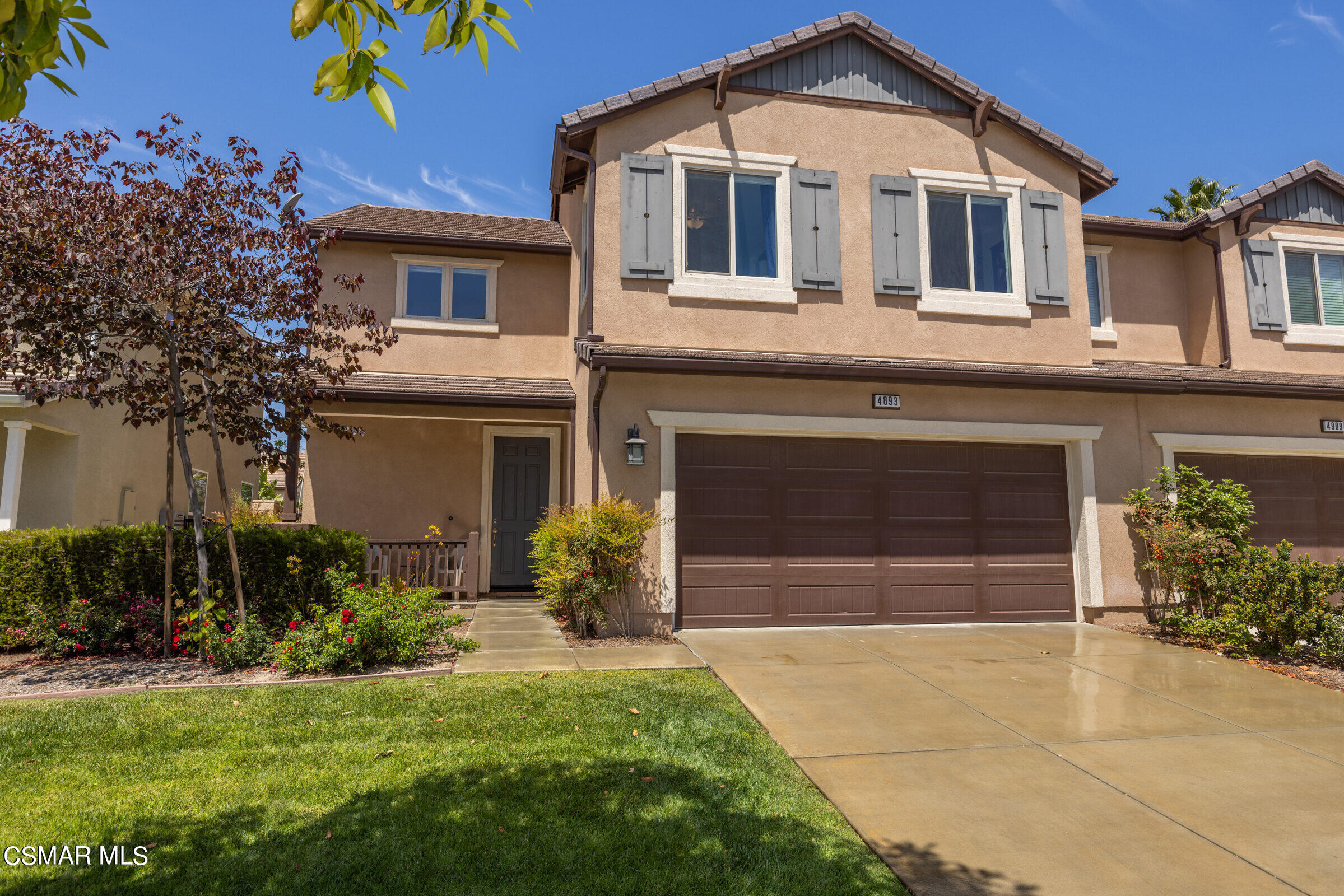 4893 Edenbridge Road Moorpark, CA 93021 - Photo 26 of 31 a front view of a house with a yard and garage