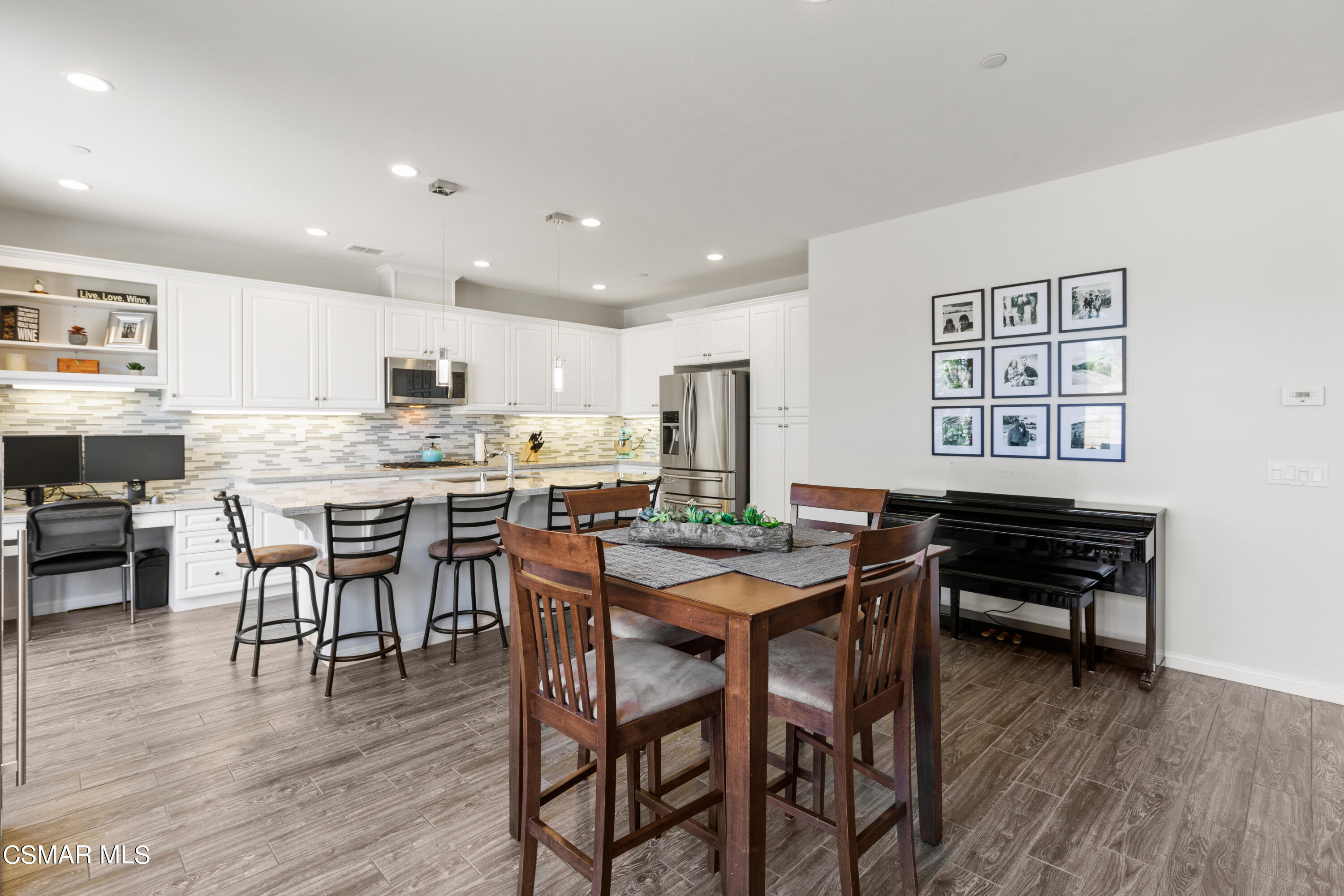 4893 Edenbridge Road Moorpark, CA 93021 - Photo 7 of 31 a kitchen with a table and chairs in it