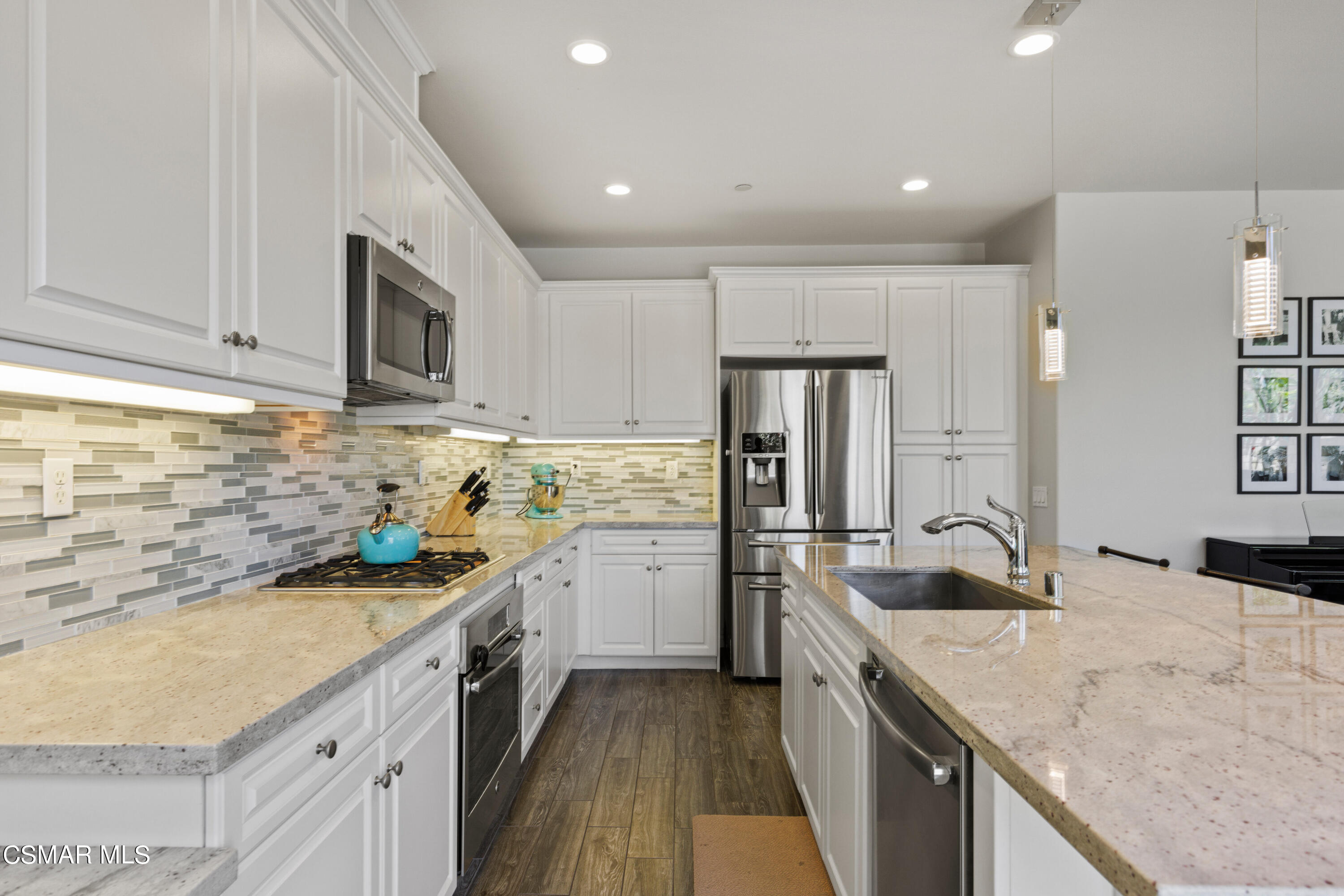 4893 Edenbridge Road Moorpark, CA 93021 - Photo 9 of 31 a kitchen with a sink stove and refrigerator