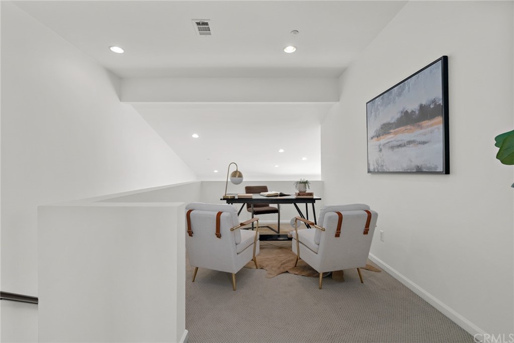5429 Strand, Unit 101 Hawthorne, CA 90250 - Photo 13 of 39 a living room with furniture and a large window