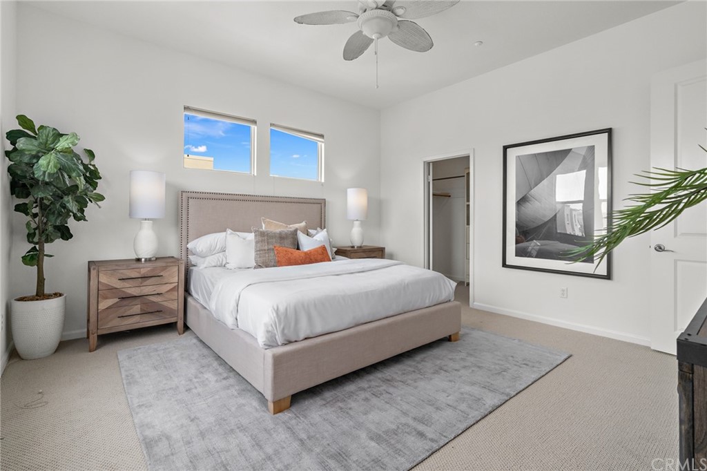 5429 Strand, Unit 101 Hawthorne, CA 90250 - Photo 16 of 39 a bedroom with a bed and a potted plant