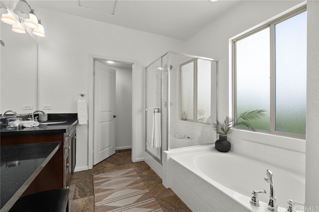 5429 Strand, Unit 101 Hawthorne, CA 90250 - Photo 18 of 39 a bathroom with a tub sink and mirror