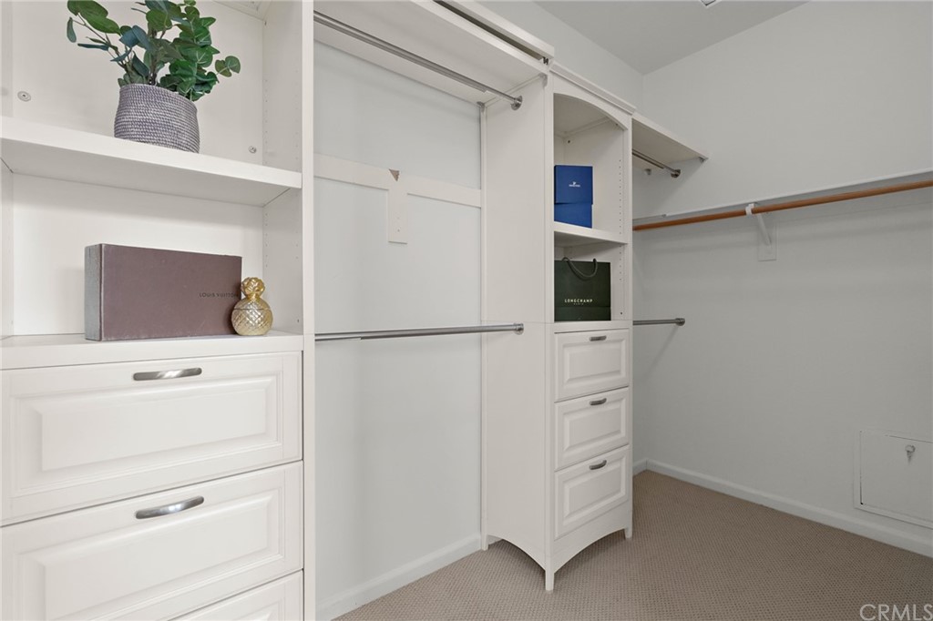 5429 Strand, Unit 101 Hawthorne, CA 90250 - Photo 20 of 39 a kitchen with white cabinets and a refrigerator