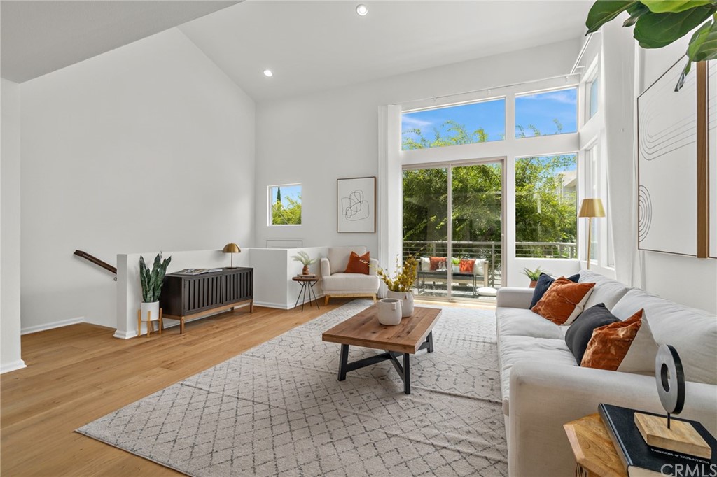 5429 Strand, Unit 101 Hawthorne, CA 90250 - Photo 2 of 39 a living room with furniture and a large window