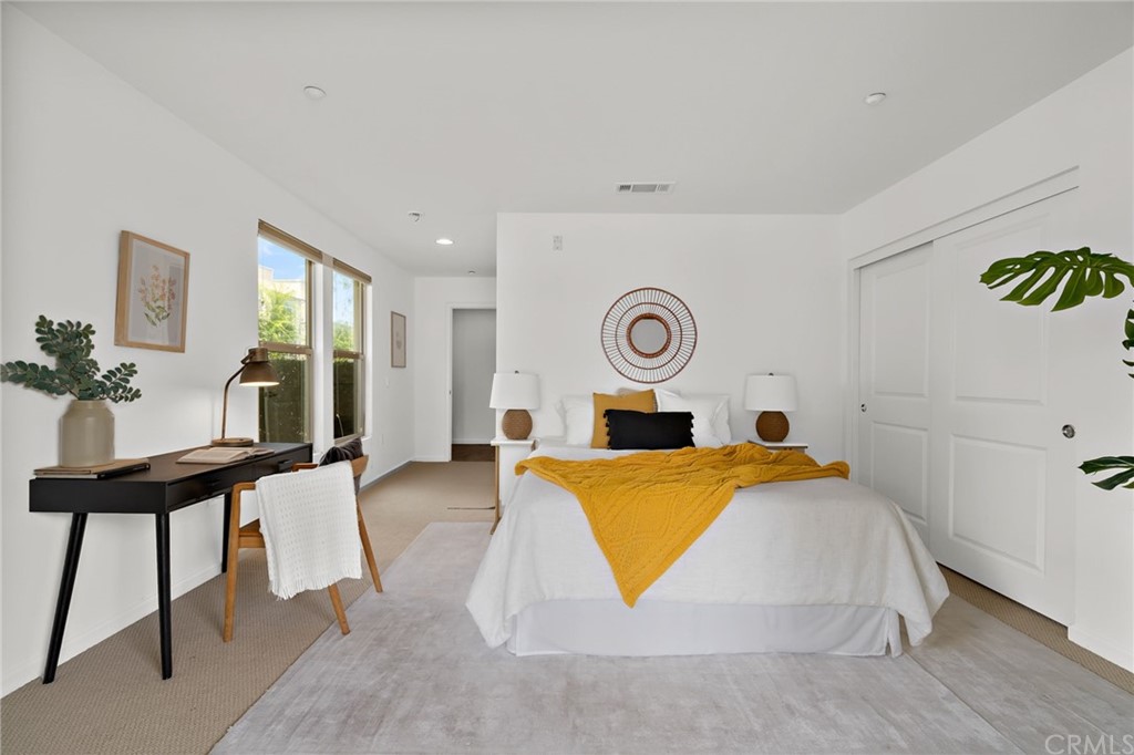 5429 Strand, Unit 101 Hawthorne, CA 90250 - Photo 24 of 39 a bed room with a bed and a table