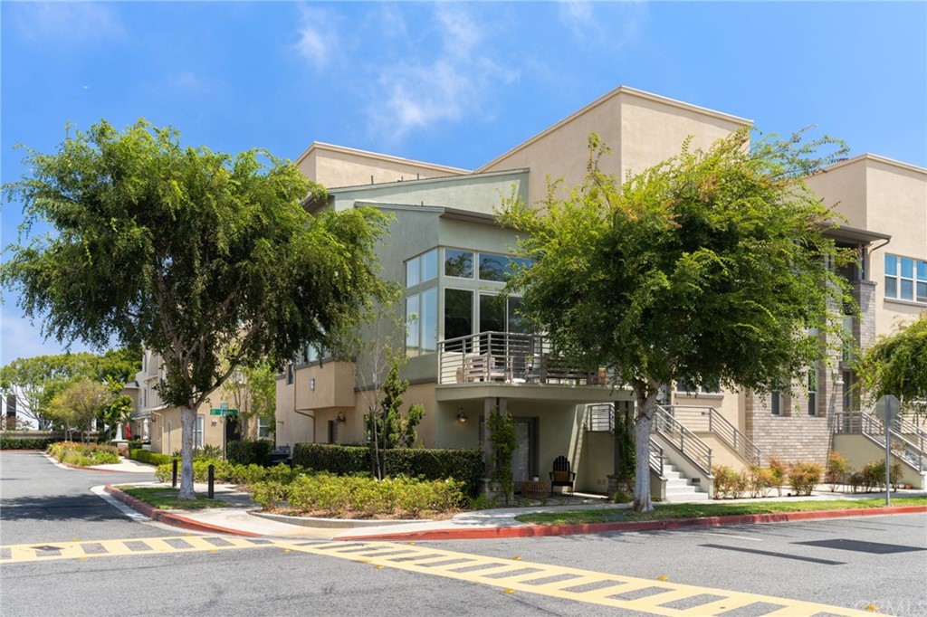 5429 Strand, Unit 101 Hawthorne, CA 90250 - Photo 28 of 39 a view of a white house with a clock tower in front of it