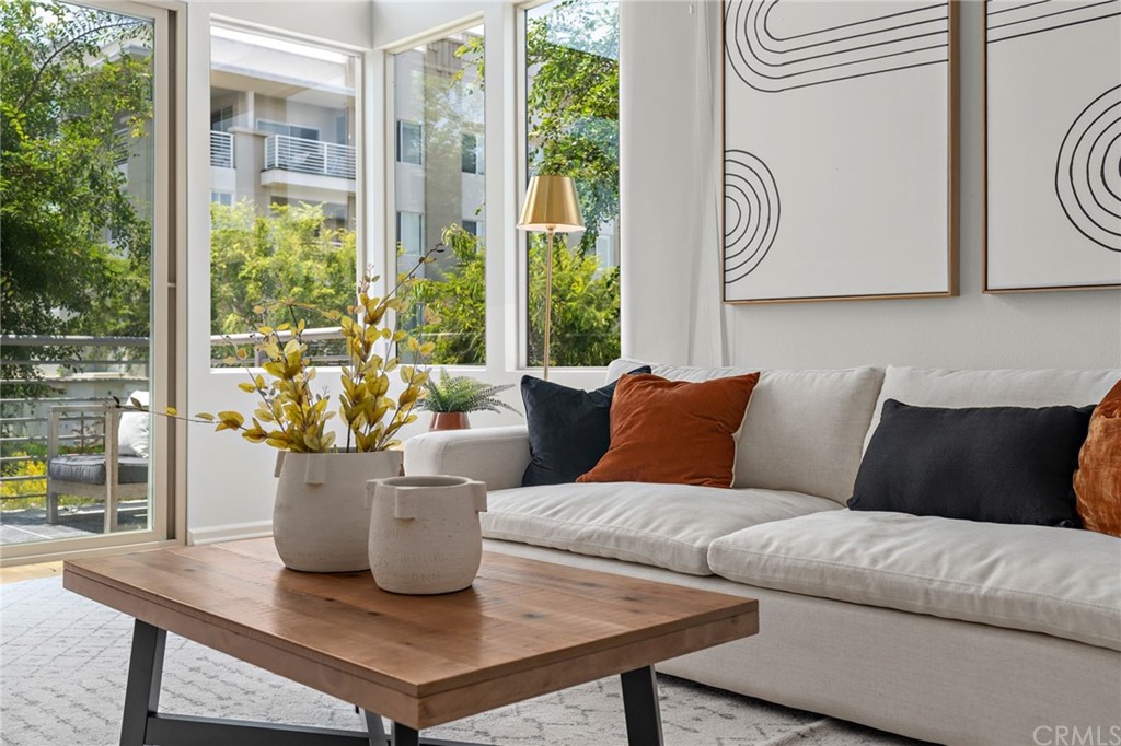 5429 Strand, Unit 101 Hawthorne, CA 90250 - Photo 3 of 39 a living room with furniture and a large window