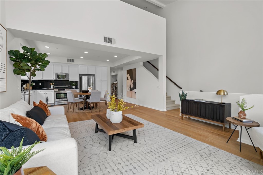 5429 Strand, Unit 101 Hawthorne, CA 90250 - Photo 5 of 39 a living room with furniture and a potted plant