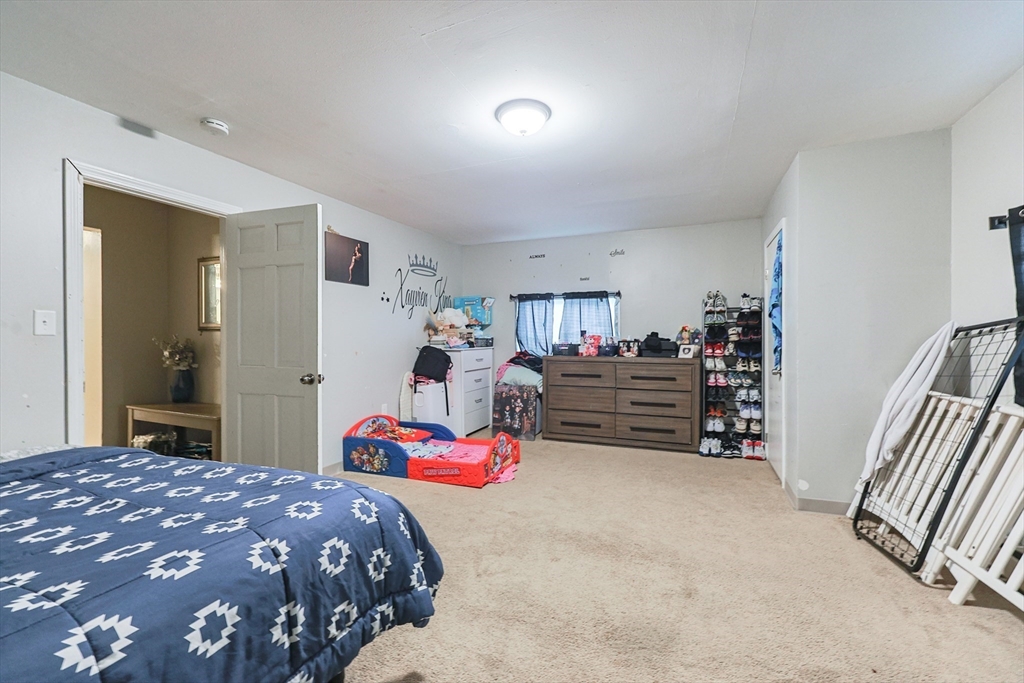 118 Maple Street Fall River, MA 02720 - Photo 11 of 36 a bedroom with bed and dresser
