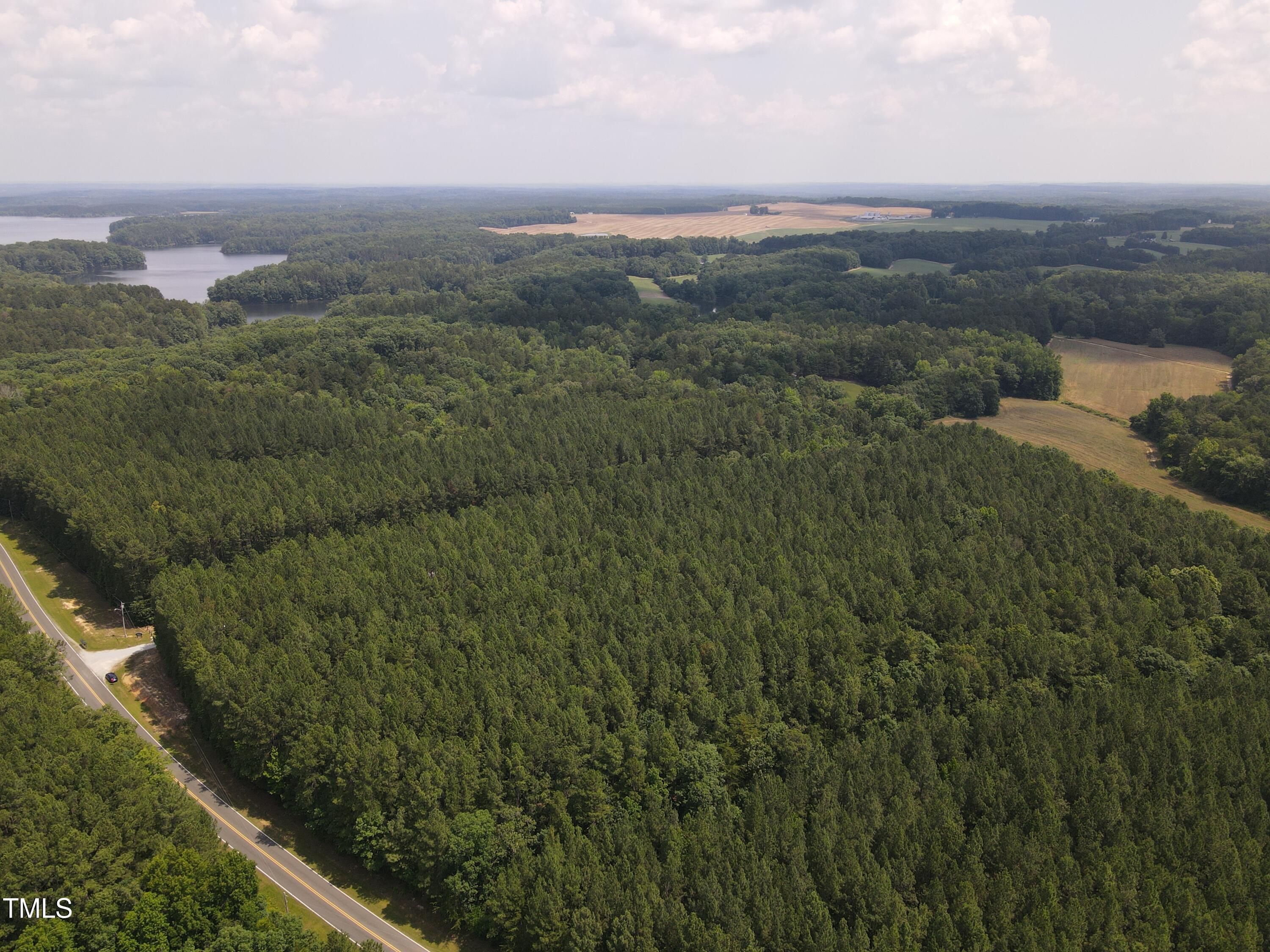 0 Shady Oak Road Roxboro, NC 27574 - Photo 5 of 18 a view of a city with lush green forest