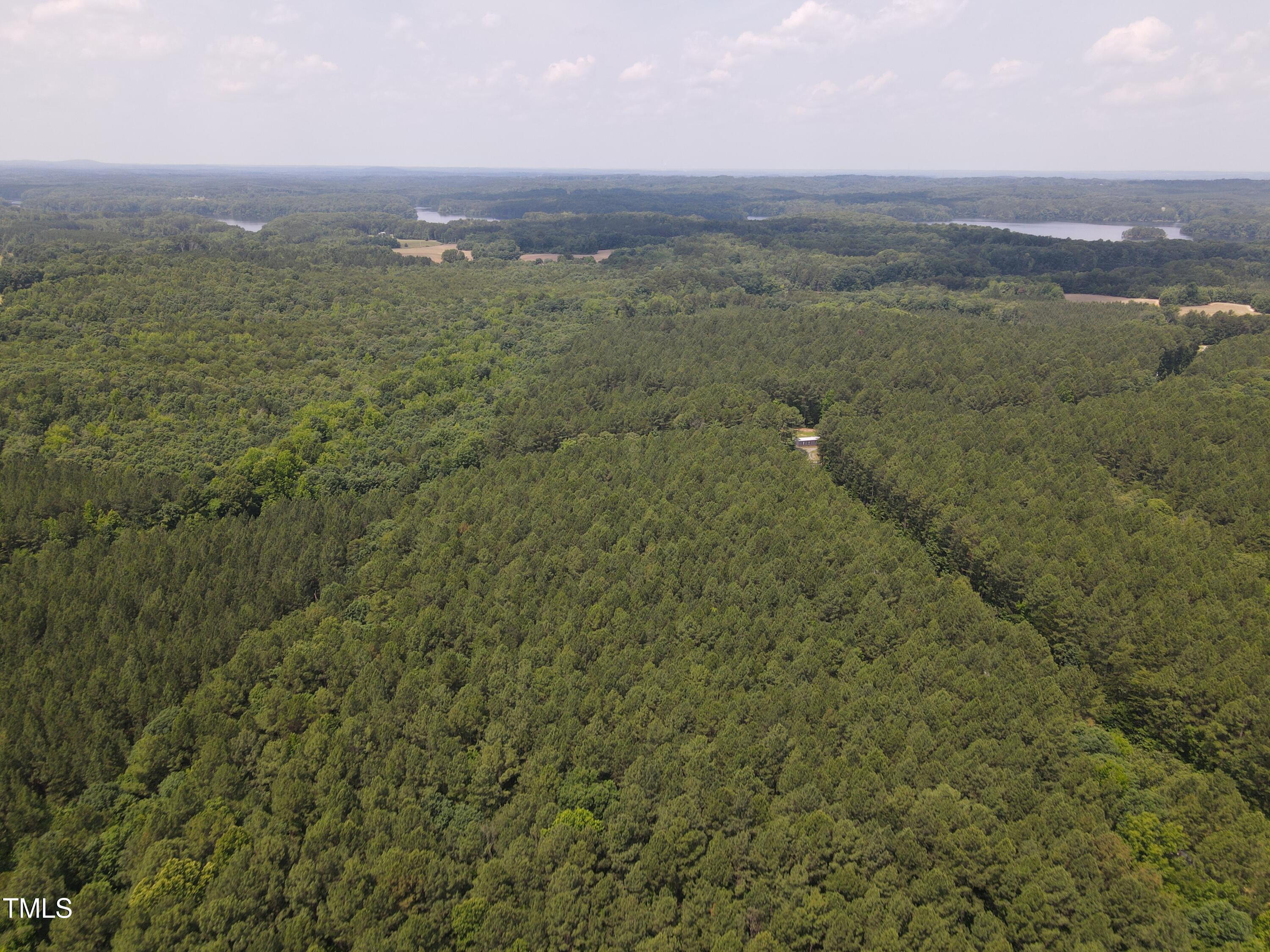0 Shady Oak Road Roxboro, NC 27574 - Photo 7 of 18 a view of a city with lush green forest