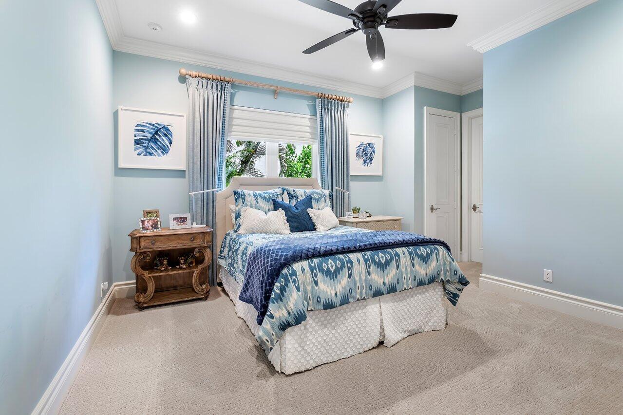 17526 Grand Este Way Boca Raton, FL 33496 - Photo 27 of 58 a bed sitting in a spacious bedroom next to a window