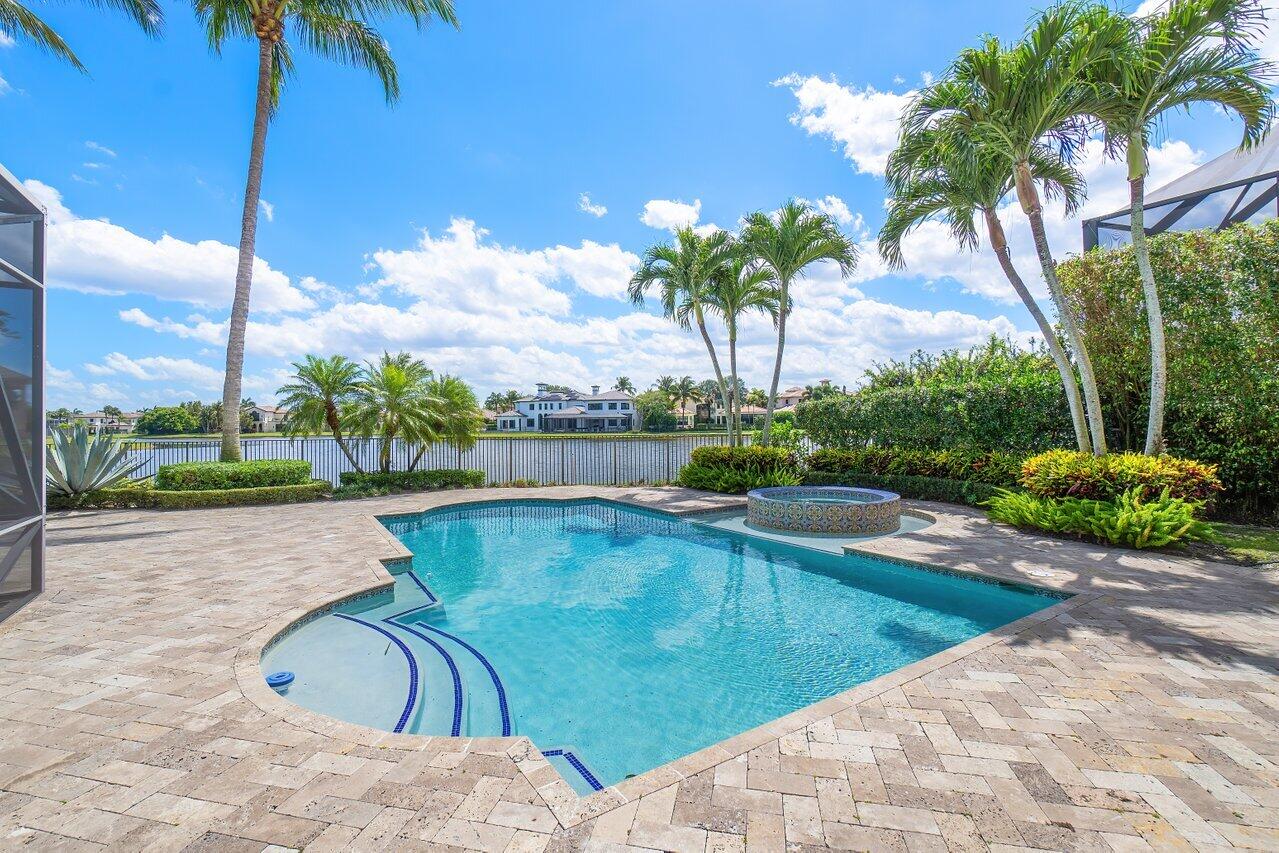 17526 Grand Este Way Boca Raton, FL 33496 - Photo 32 of 58 a view of a swimming pool with a patio