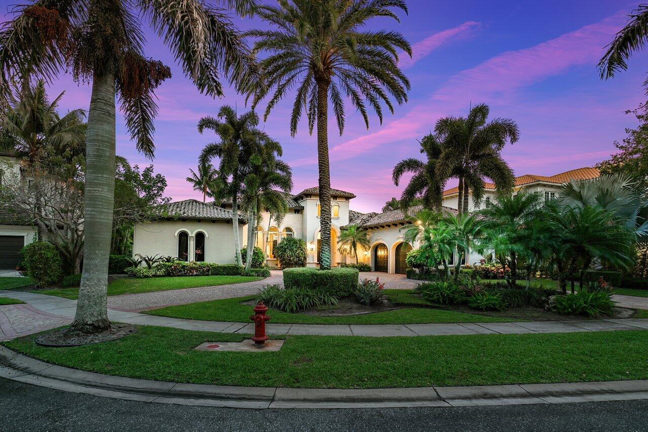 17526 Grand Este Way Boca Raton, FL 33496 - Photo 43 of 58 a palm tree sitting in front of a house with a garden