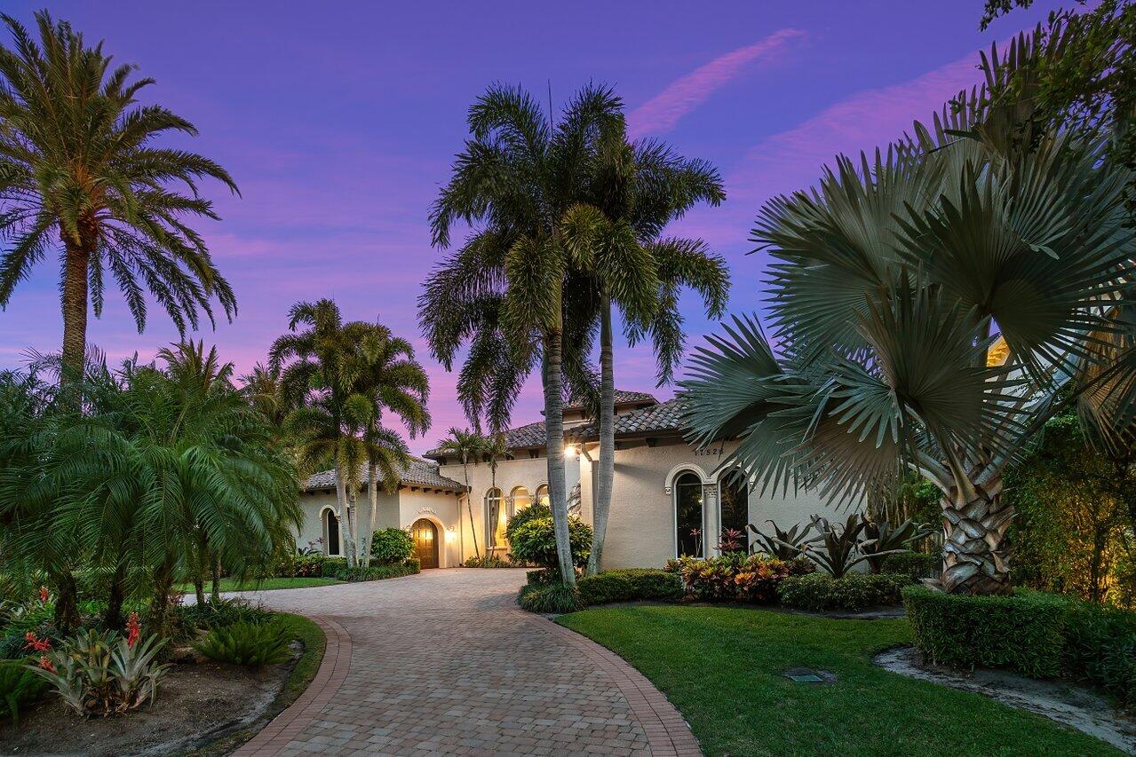 17526 Grand Este Way Boca Raton, FL 33496 - Photo 45 of 58 a front view of house with small garden and palm trees