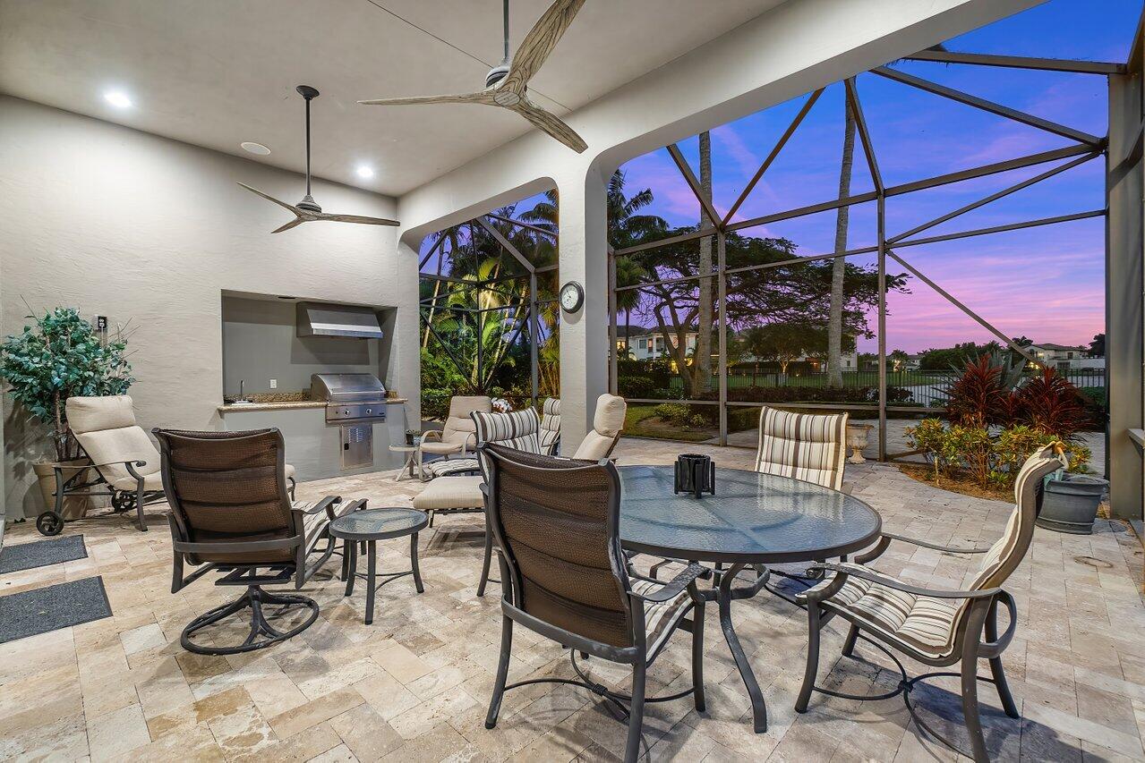 17526 Grand Este Way Boca Raton, FL 33496 - Photo 46 of 58 a dining room with furniture and a floor to ceiling window