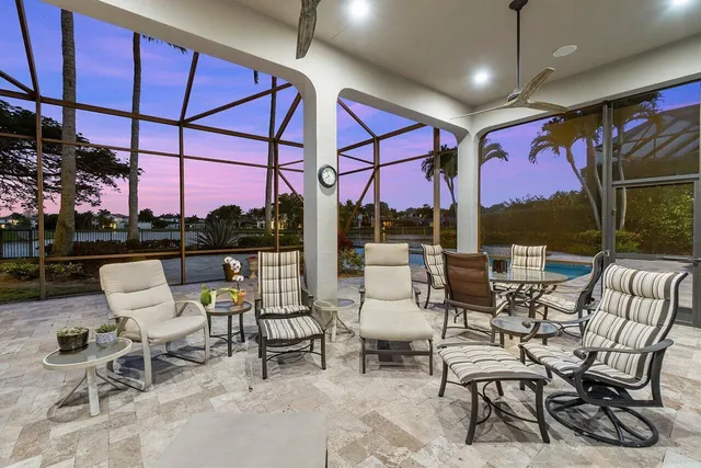 an aerial view of residential houses with outdoor space and lake view