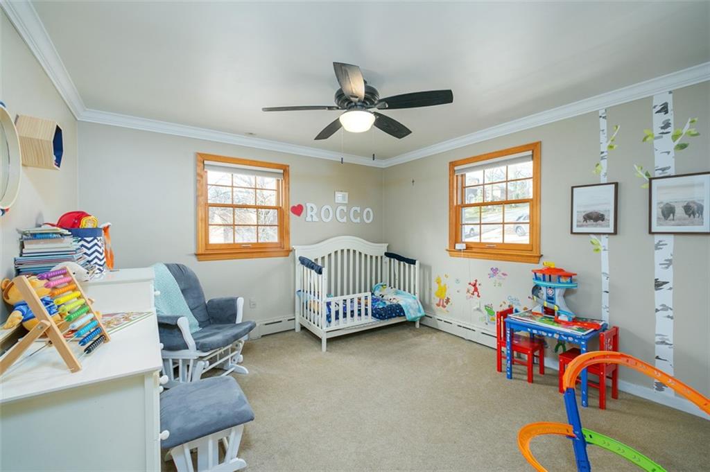 697 Filmore Road Pittsburgh, PA 15221 - Photo 29 of 42 a bedroom with furniture and a window
