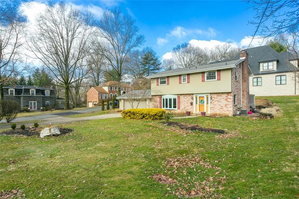 697 Filmore Road Pittsburgh, PA 15221 - Photo 3 of 42 a view of a house with a big yard