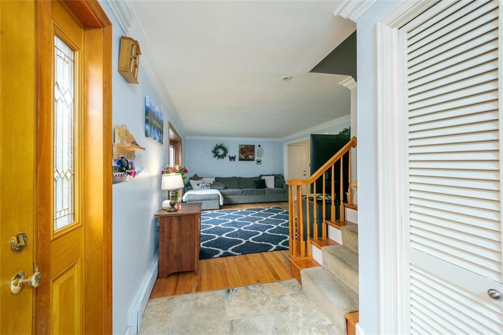 697 Filmore Road Pittsburgh, PA 15221 - Photo 7 of 42 a view of entryway and hall with wooden floor