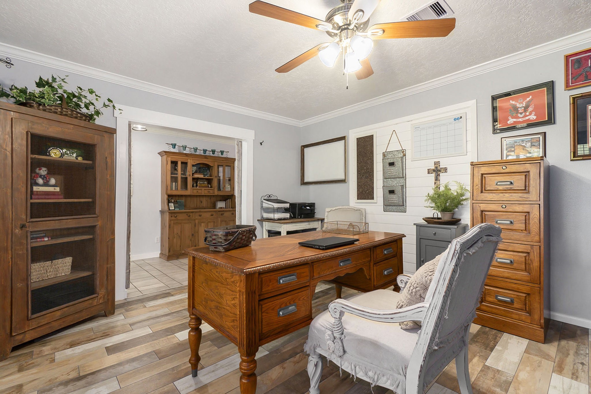 7363 County Line Road Willis, TX 77378 - Photo 6 of 34 Expansive study featuring a built-in bookshelf, perfect for productivity and organization.