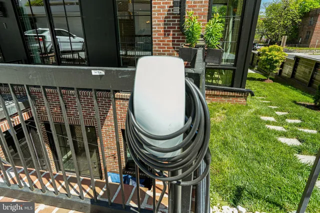 a backyard of a house with fountain table and chairs