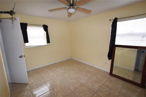 a view of an empty room with a window