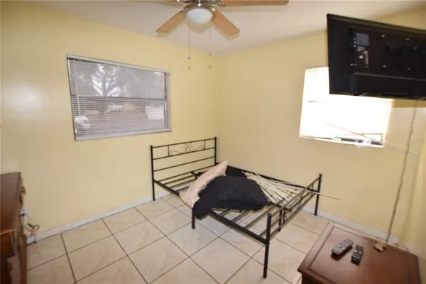 a bedroom with a bed and a dresser