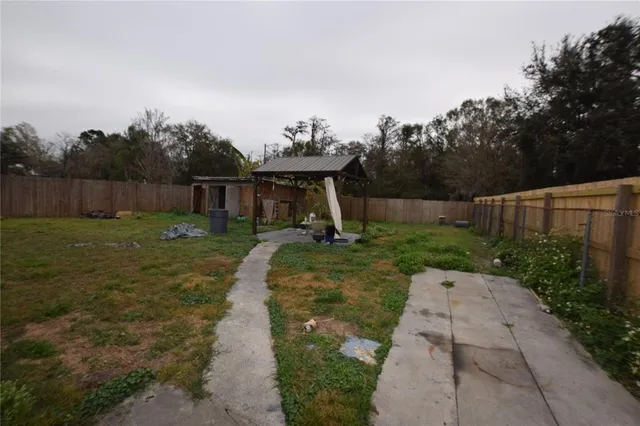 a view of a backyard with green space