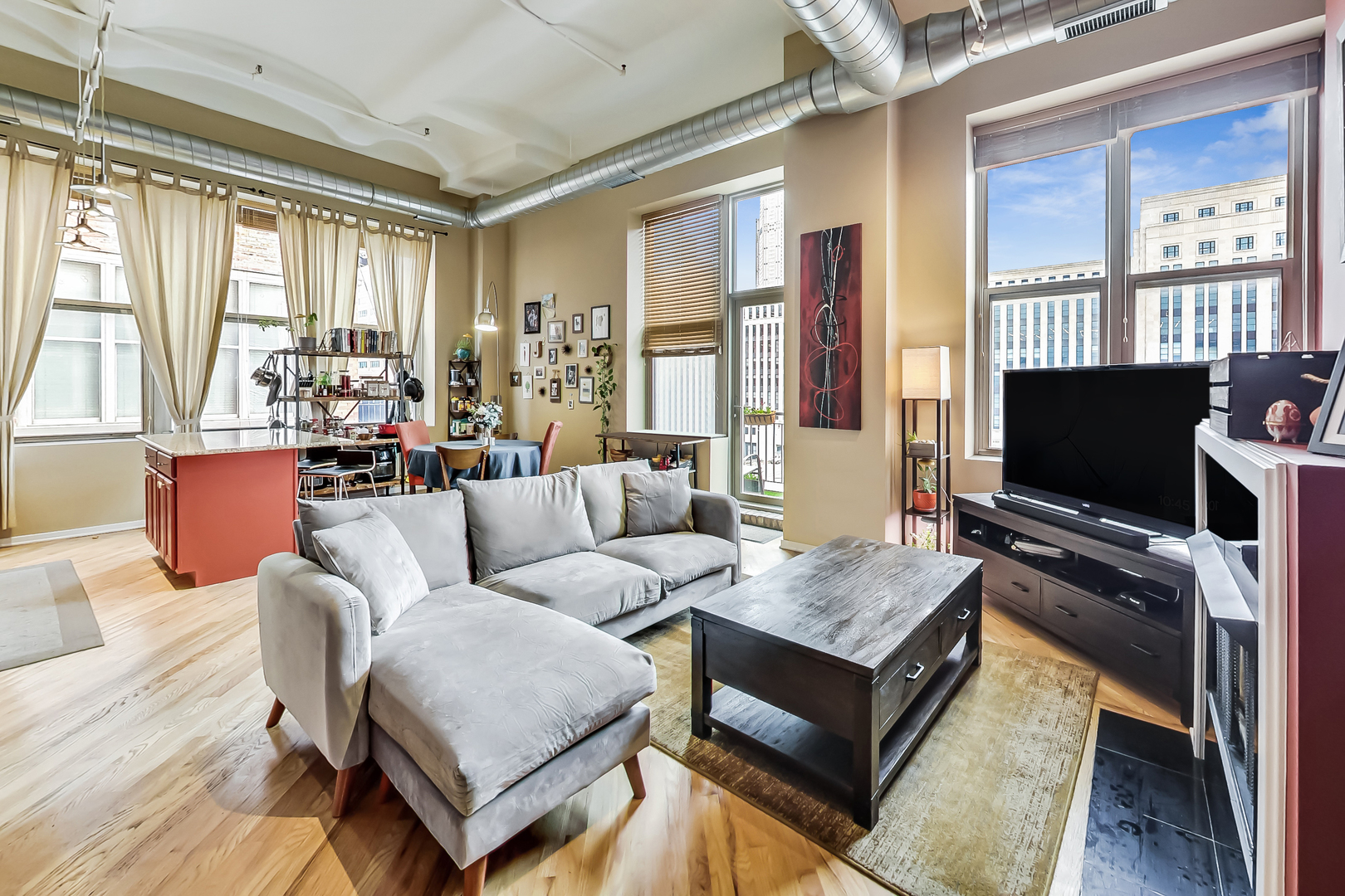 500 South Clinton Street, Unit 810 Chicago, IL 60607 - Photo 16 of 54 a living room with furniture and a flat screen tv