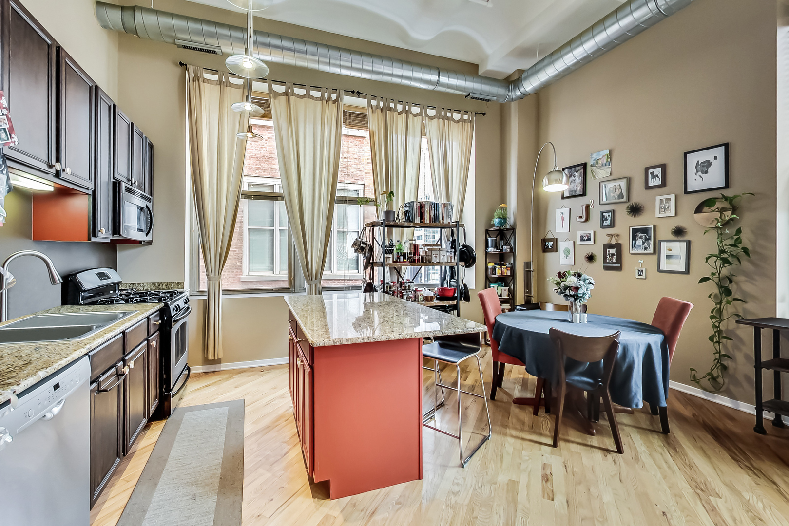 500 South Clinton Street, Unit 810 Chicago, IL 60607 - Photo 24 of 54 a kitchen with stainless steel appliances granite countertop sink stove top oven and cabinets