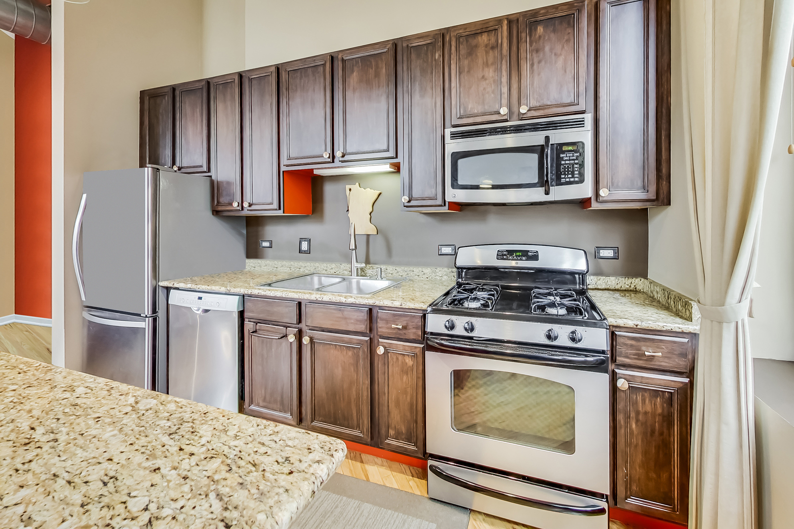 500 South Clinton Street, Unit 810 Chicago, IL 60607 - Photo 25 of 54 a kitchen with a stove and a microwave