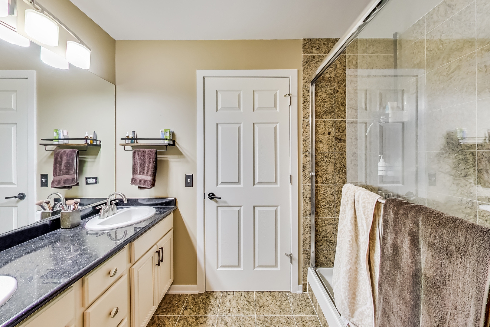 500 South Clinton Street, Unit 810 Chicago, IL 60607 - Photo 37 of 54 a bathroom with a granite countertop sink and a mirror